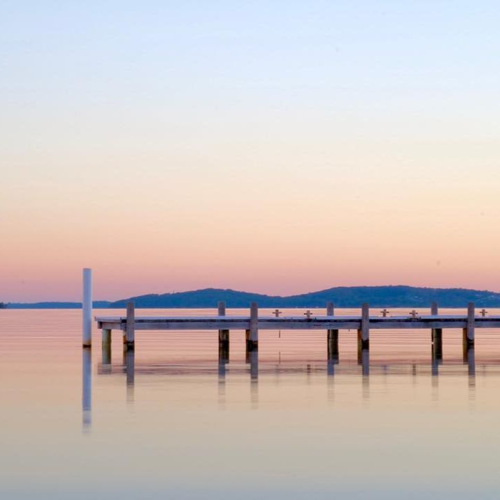 A jetty pictured at sunset in Lake Macquarie